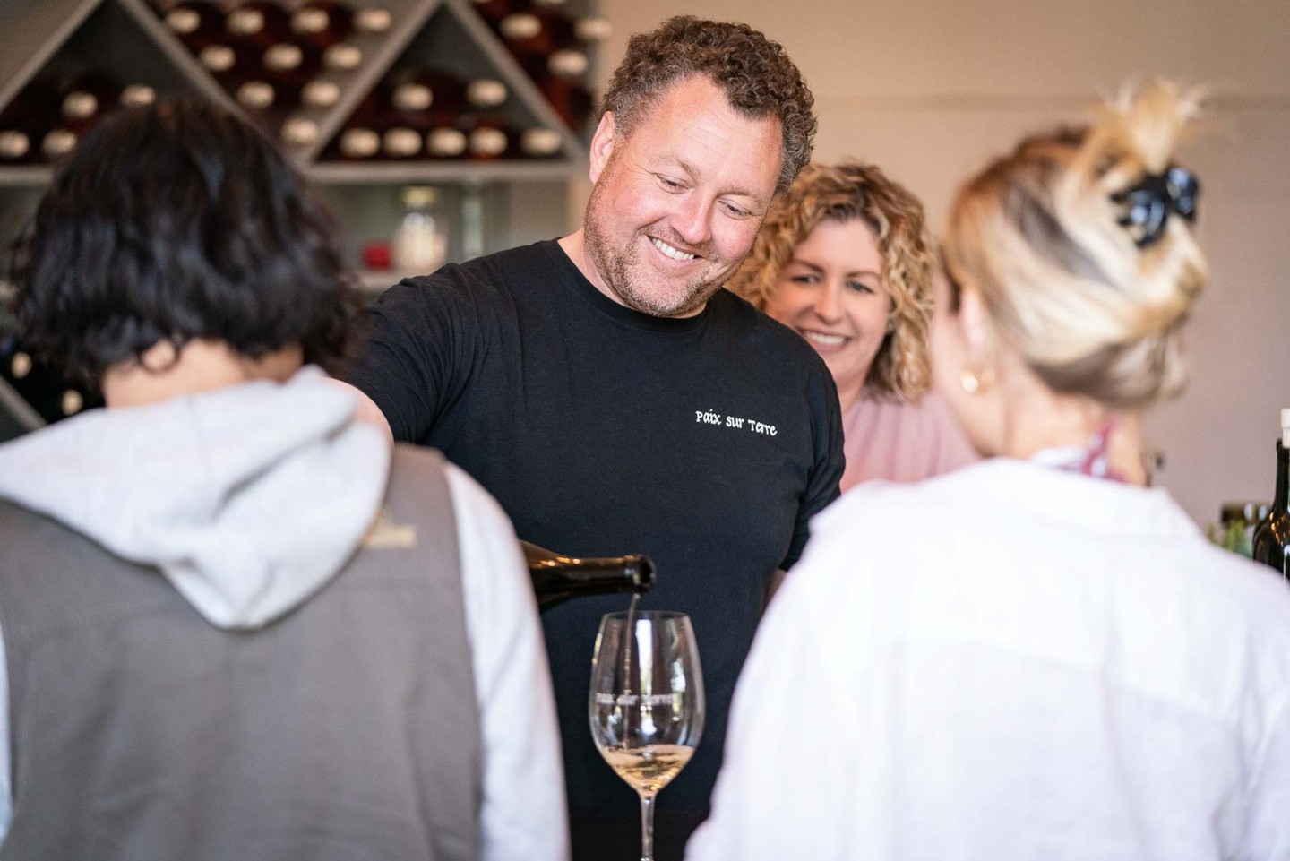 Ryan and Nicole pouring wine in the tasting room